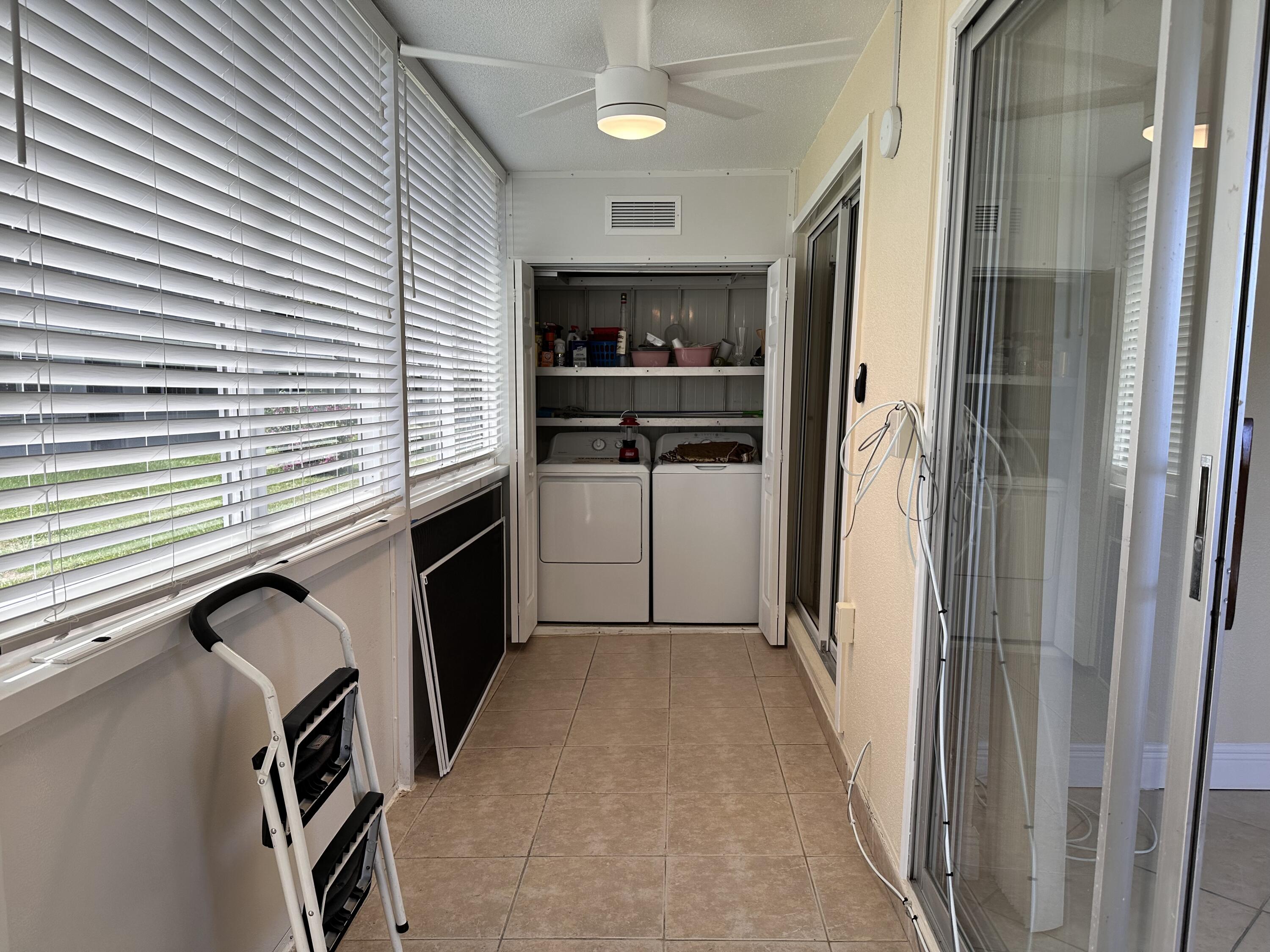 433 Saxony Way Delray Beach, FL 33446 - Photo 26 of 49 a kitchen with a refrigerator and a sink