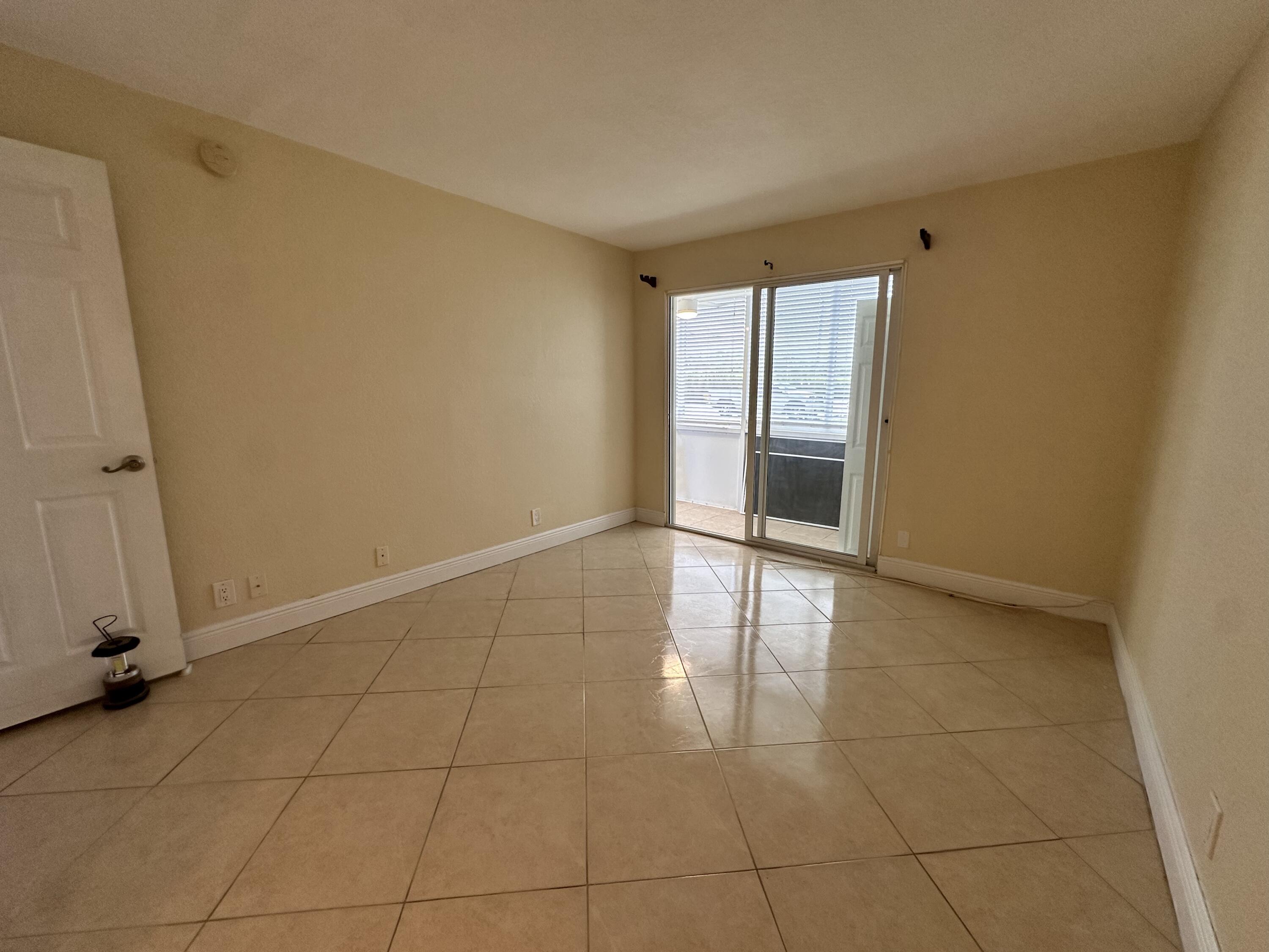 433 Saxony Way Delray Beach, FL 33446 - Photo 34 of 49 a view of an empty room with a window
