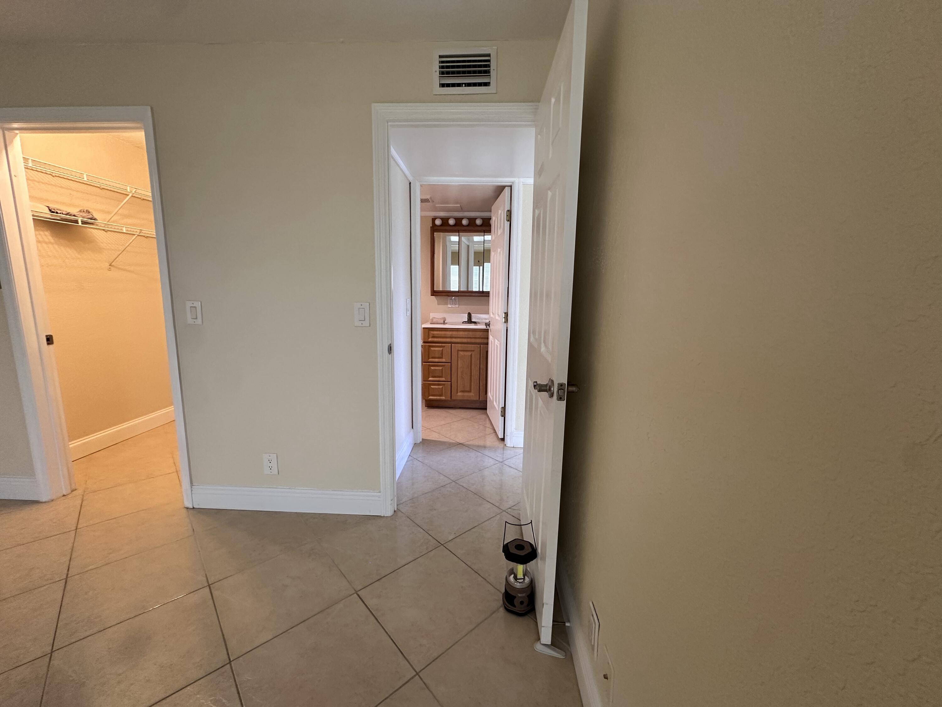 433 Saxony Way Delray Beach, FL 33446 - Photo 38 of 49 a view of a hallway to rooms and a room