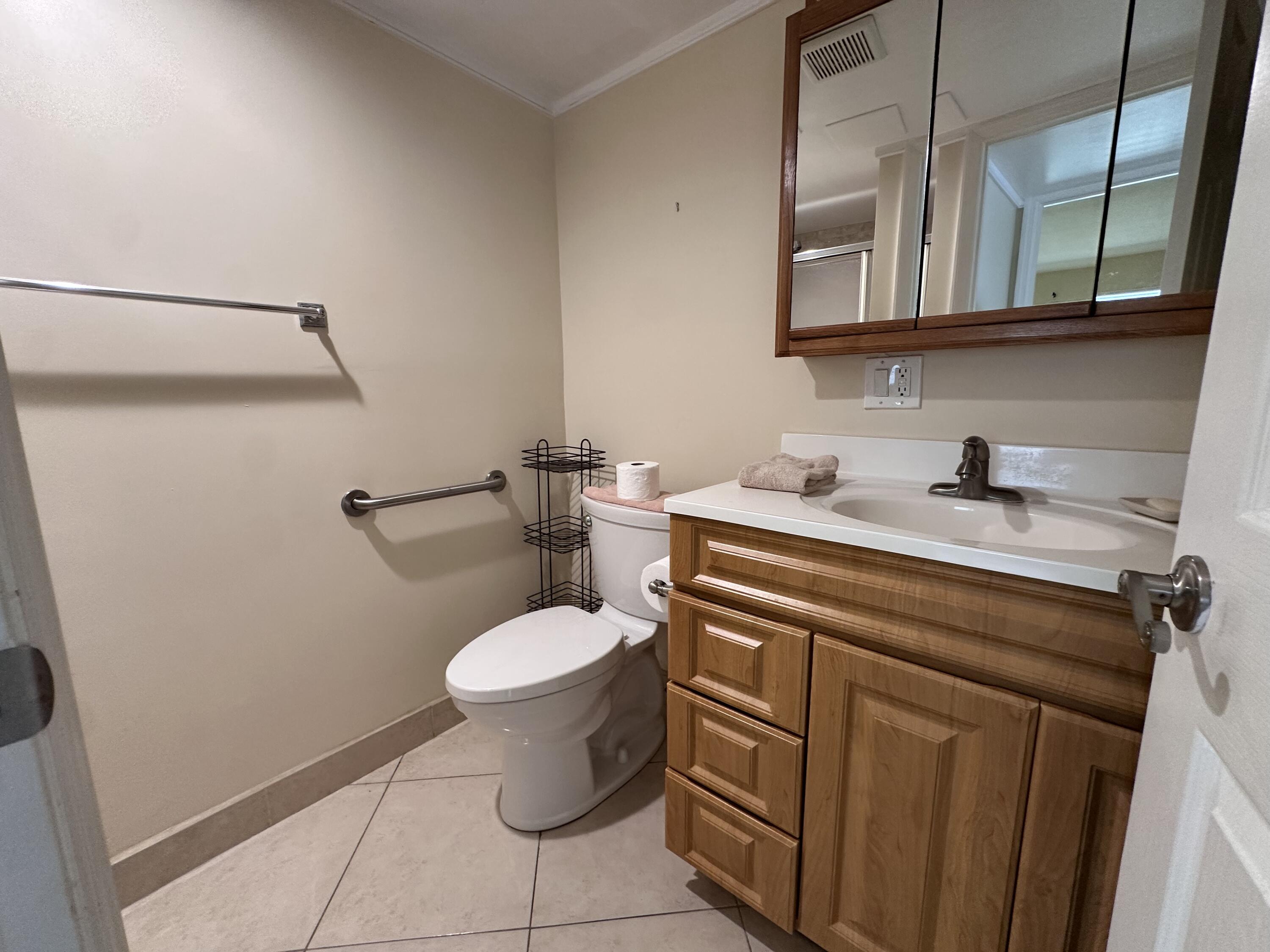 433 Saxony Way Delray Beach, FL 33446 - Photo 39 of 49 a bathroom with a sink and a toilet