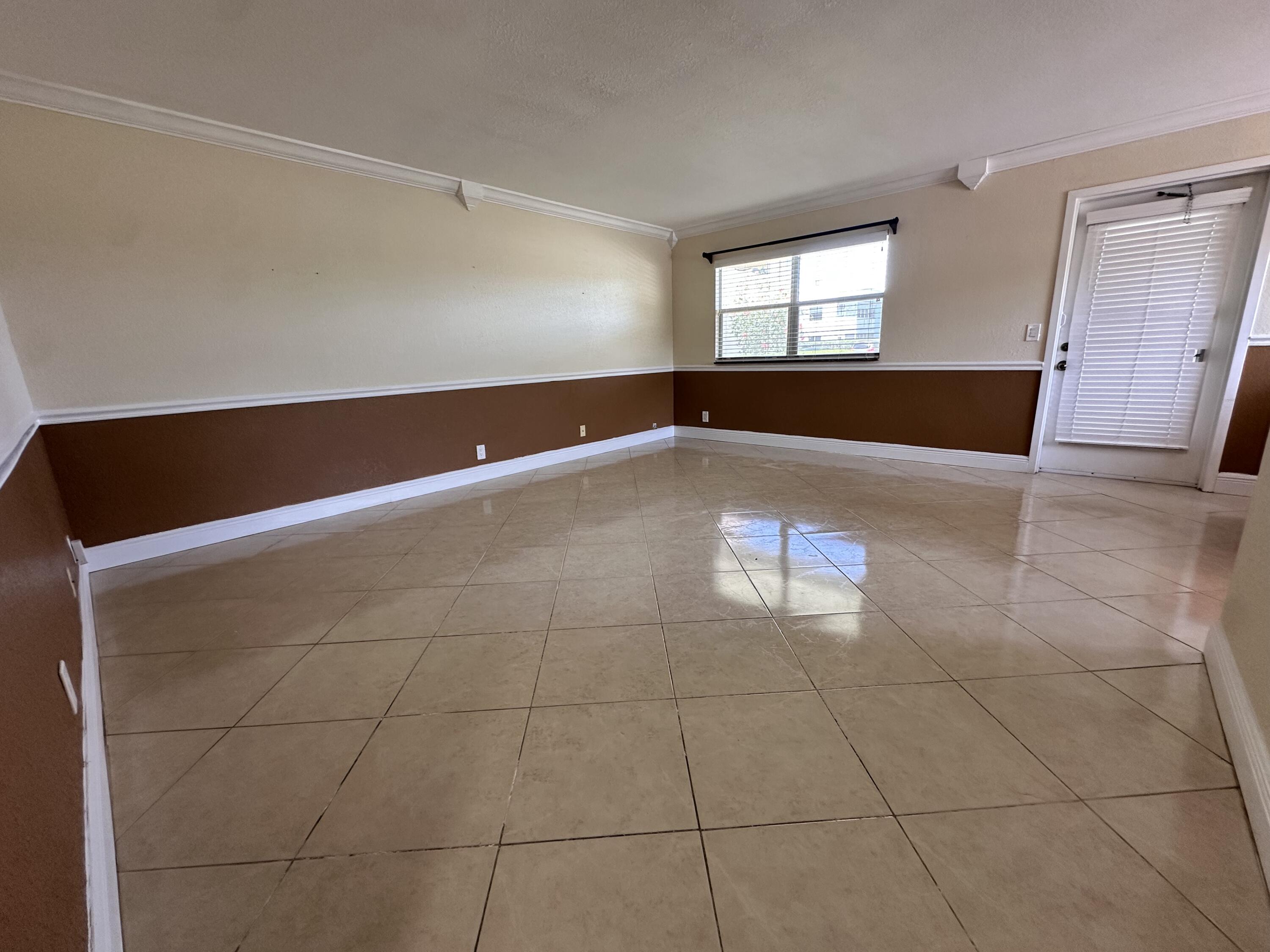 433 Saxony Way Delray Beach, FL 33446 - Photo 4 of 49 a view of an empty room with a window