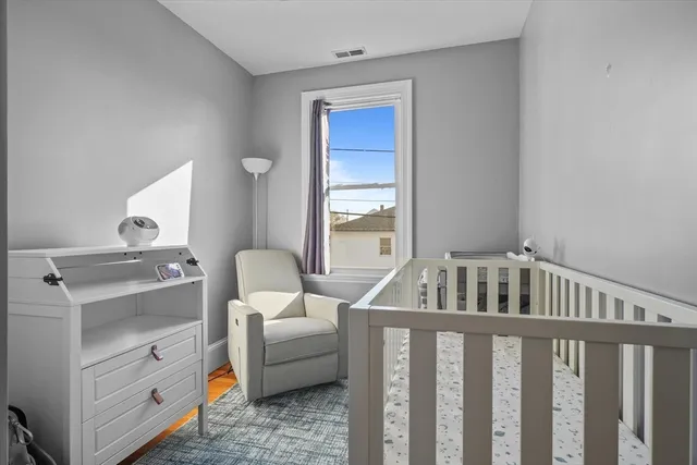 a bedroom with furniture and a window