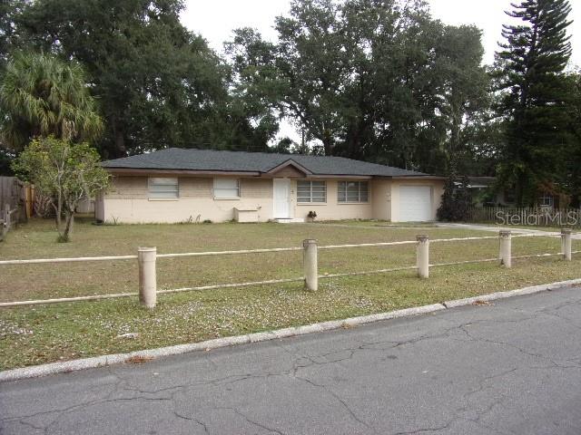3226 Independence Avenue Lakeland, FL 33803 - Photo 1 of 19 a front view of a house with a yard