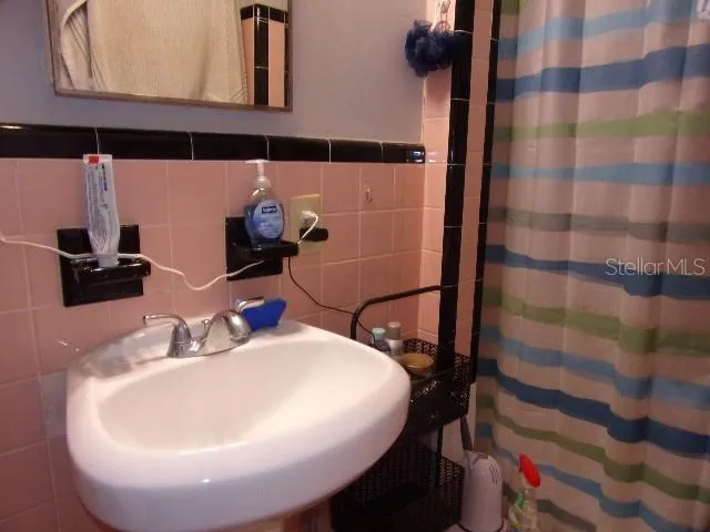 a bathroom with a sink and toilet