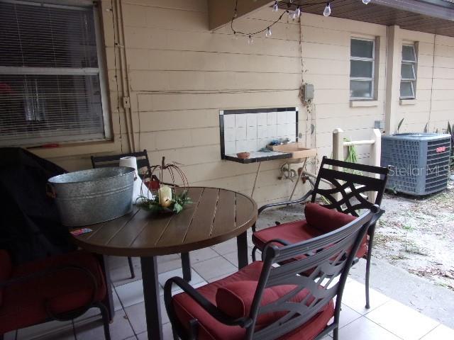 3226 Independence Avenue Lakeland, FL 33803 - Photo 16 of 19 a table and chairs sitting in a backyard of a house