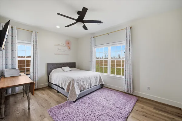 a bathroom with a sink a mirror and a shower