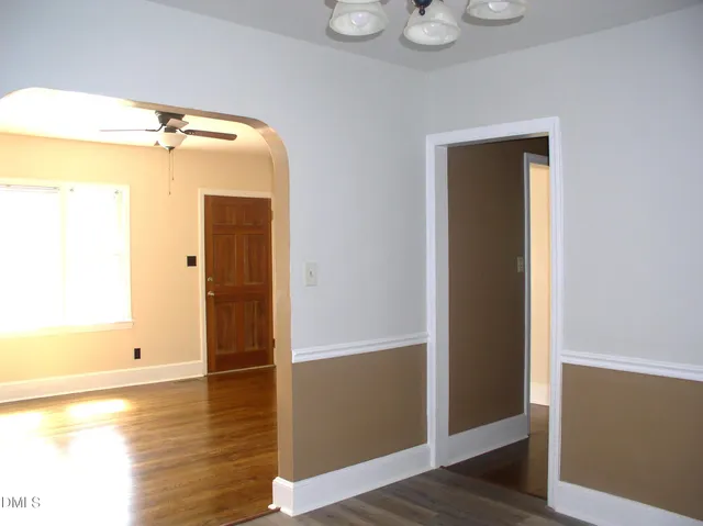 a view of a bathroom with wooden floor