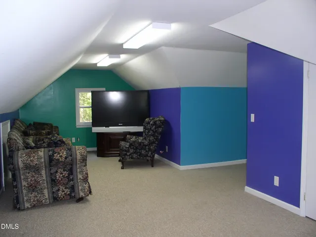 a view of a room with a large window