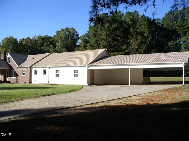 a house with trees in the background