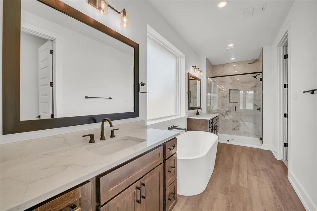 229 Lasso Loop Lorena, TX 76655 - Photo 14 of 30 a bathroom with a sink a toilet and shower