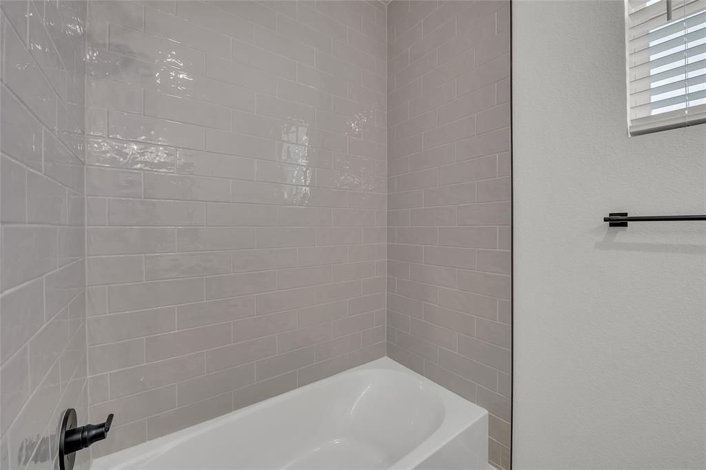229 Lasso Loop Lorena, TX 76655 - Photo 23 of 30 a bathroom with a bathtub