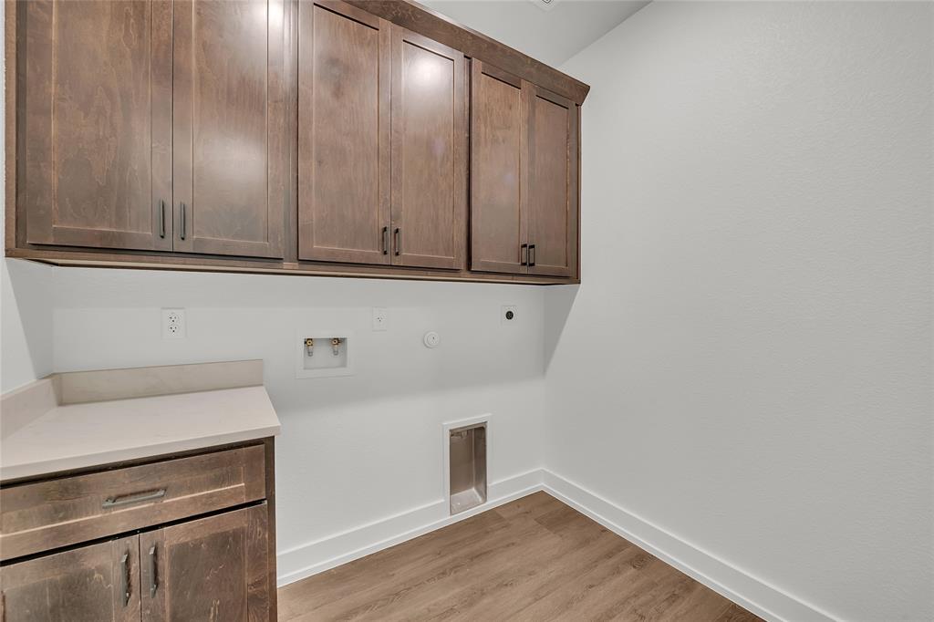 229 Lasso Loop Lorena, TX 76655 - Photo 26 of 30 a view of cabinets with wooden floor