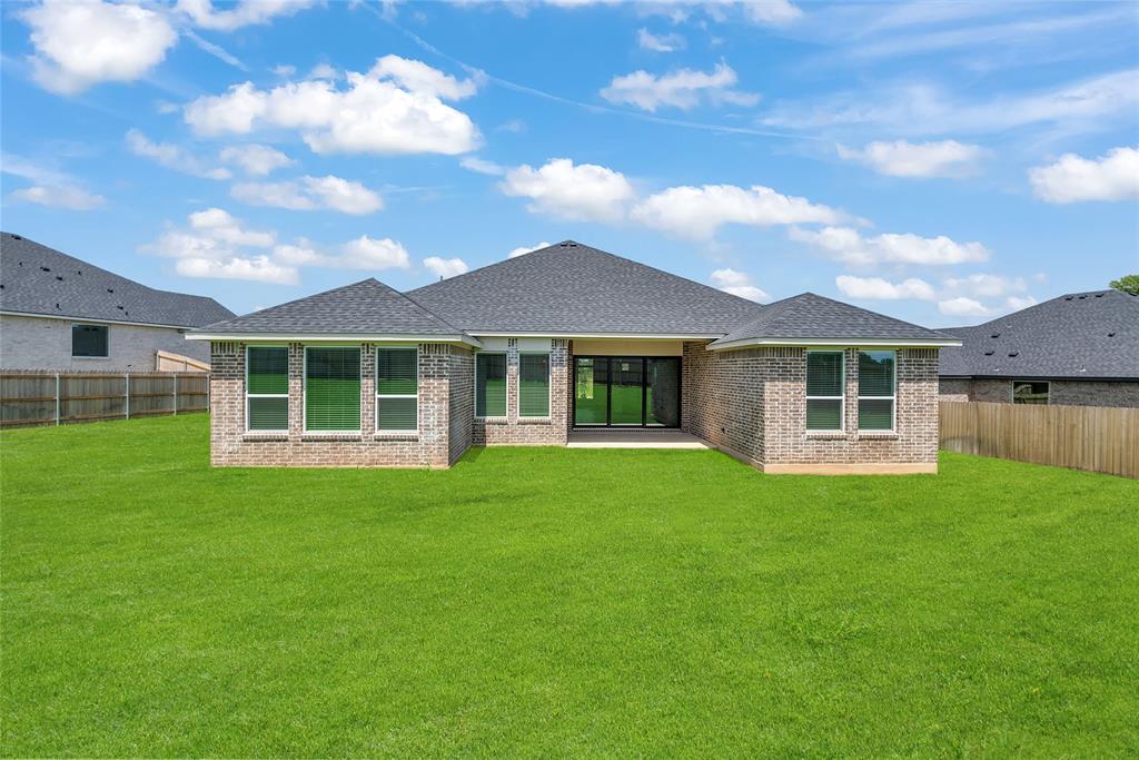 229 Lasso Loop Lorena, TX 76655 - Photo 28 of 30 a front view of a house with a garden