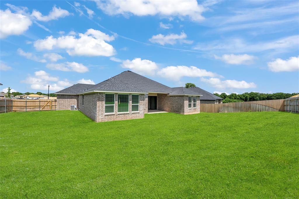 229 Lasso Loop Lorena, TX 76655 - Photo 29 of 30 a front view of a house with a yard