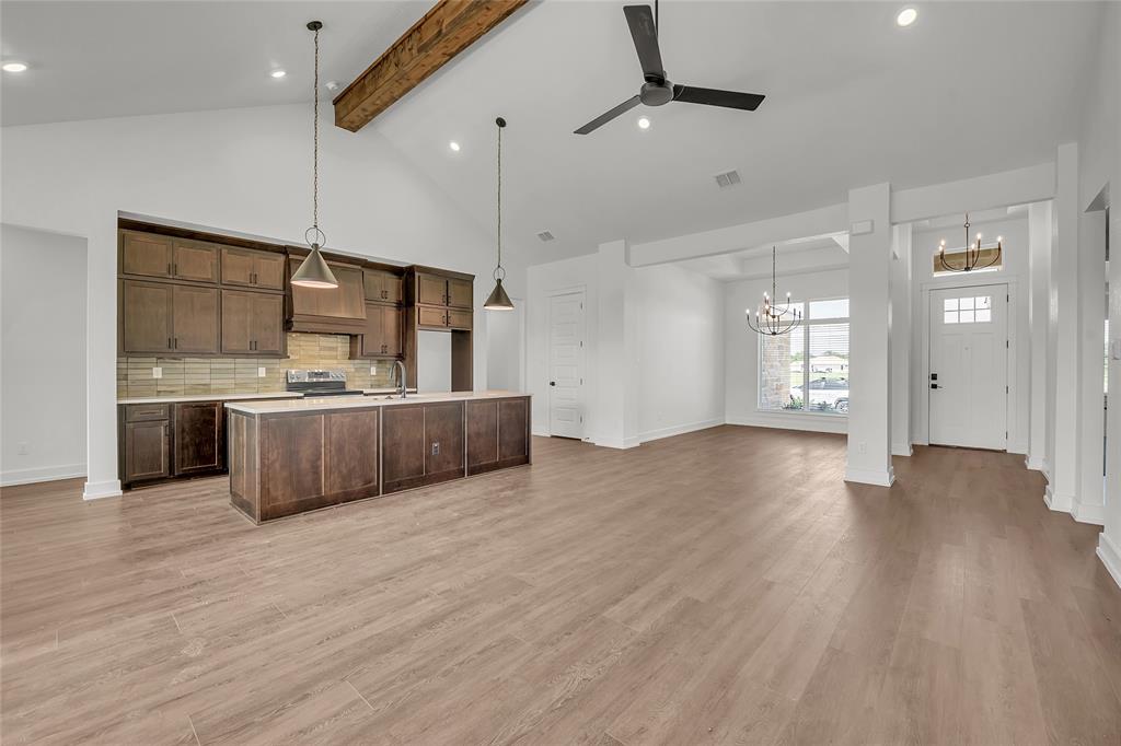 229 Lasso Loop Lorena, TX 76655 - Photo 7 of 30 a large kitchen with kitchen island a sink stainless steel appliances and cabinets