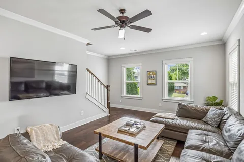a living room with furniture and a window