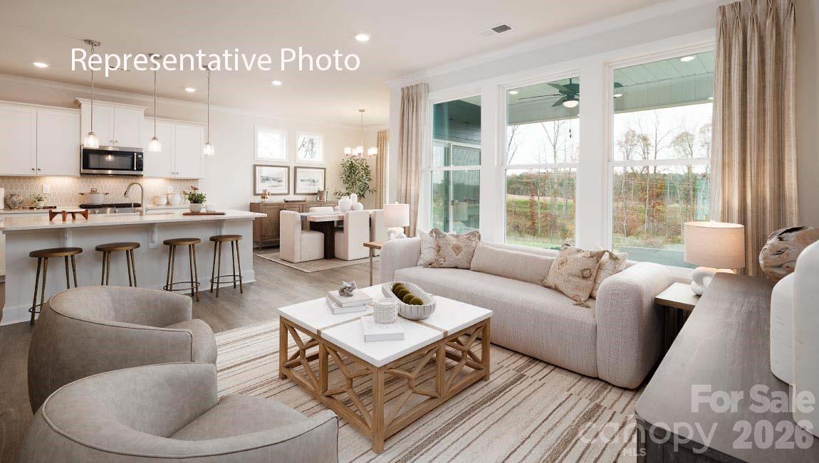 4139 Round Table Drive Gastonia, NC 28056 - Photo 9 of 24 a living room with furniture wooden floor and a large window