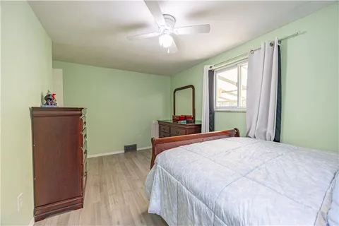 a bedroom with a bed and a dresser