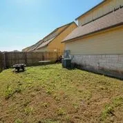 a view of a backyard of the house