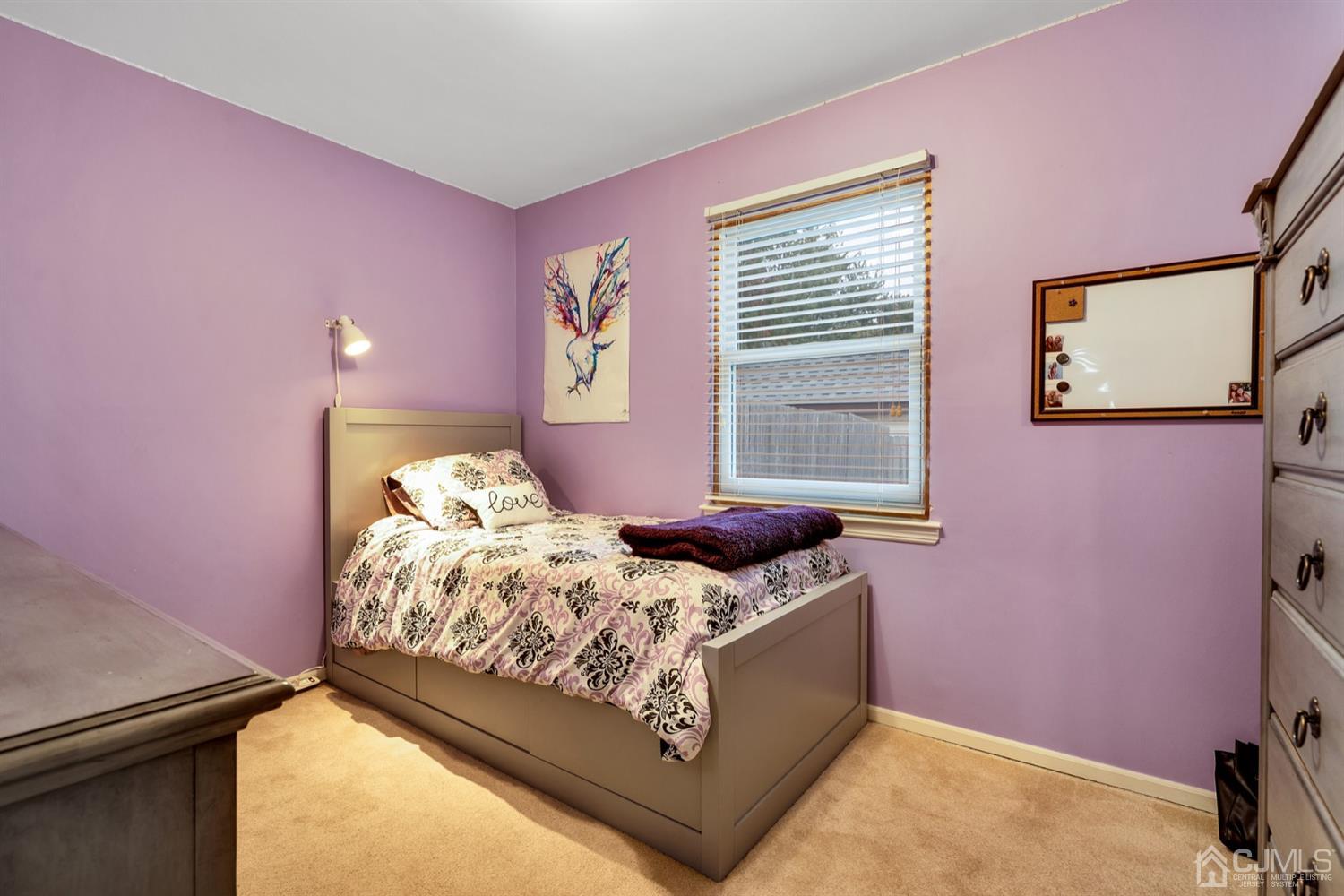 38 Homestead Road Edison, NJ 08820 - Photo 12 of 15 a bedroom with a bed and a window