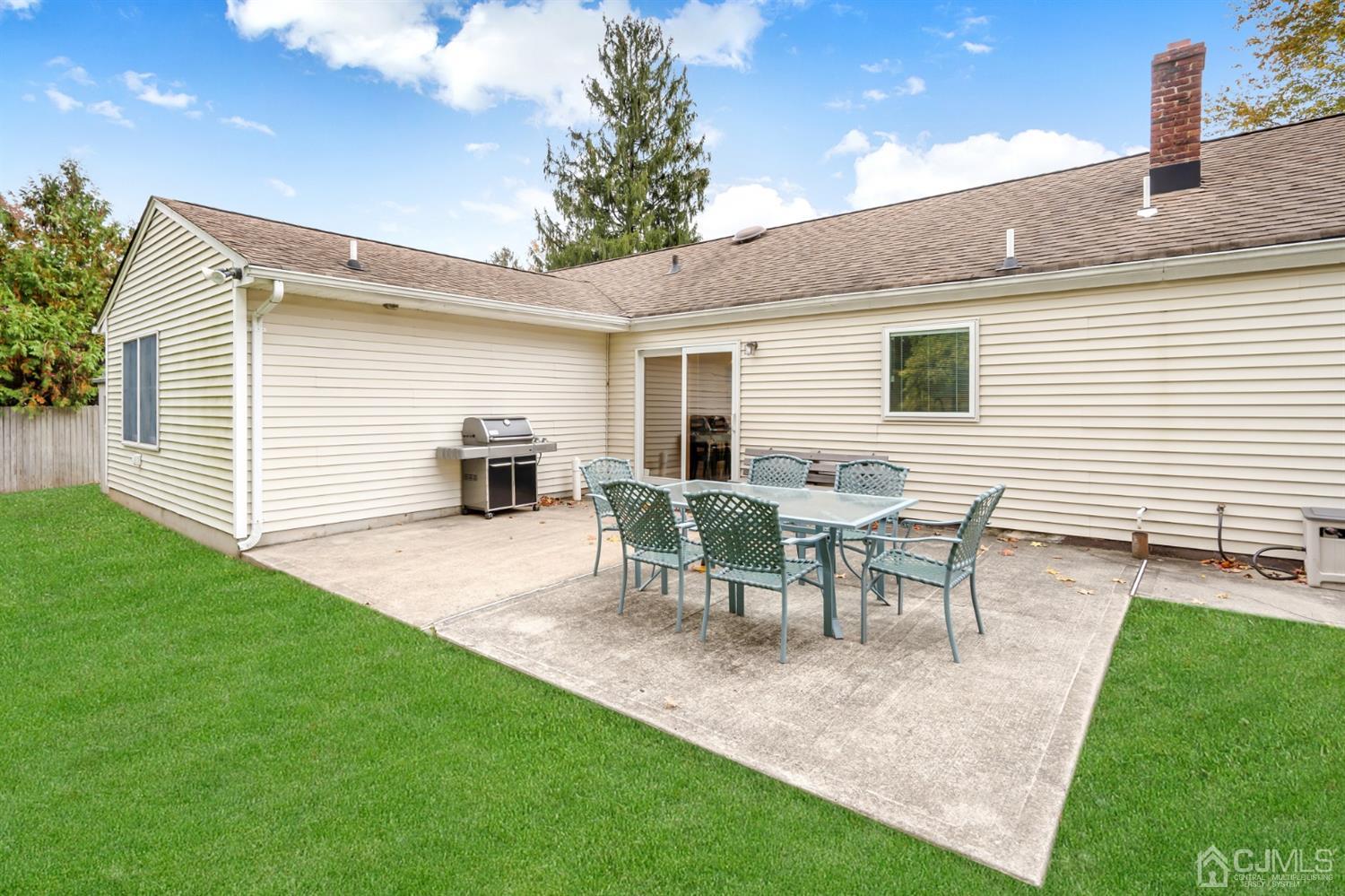 38 Homestead Road Edison, NJ 08820 - Photo 13 of 15 a view of a backyard with table and chairs