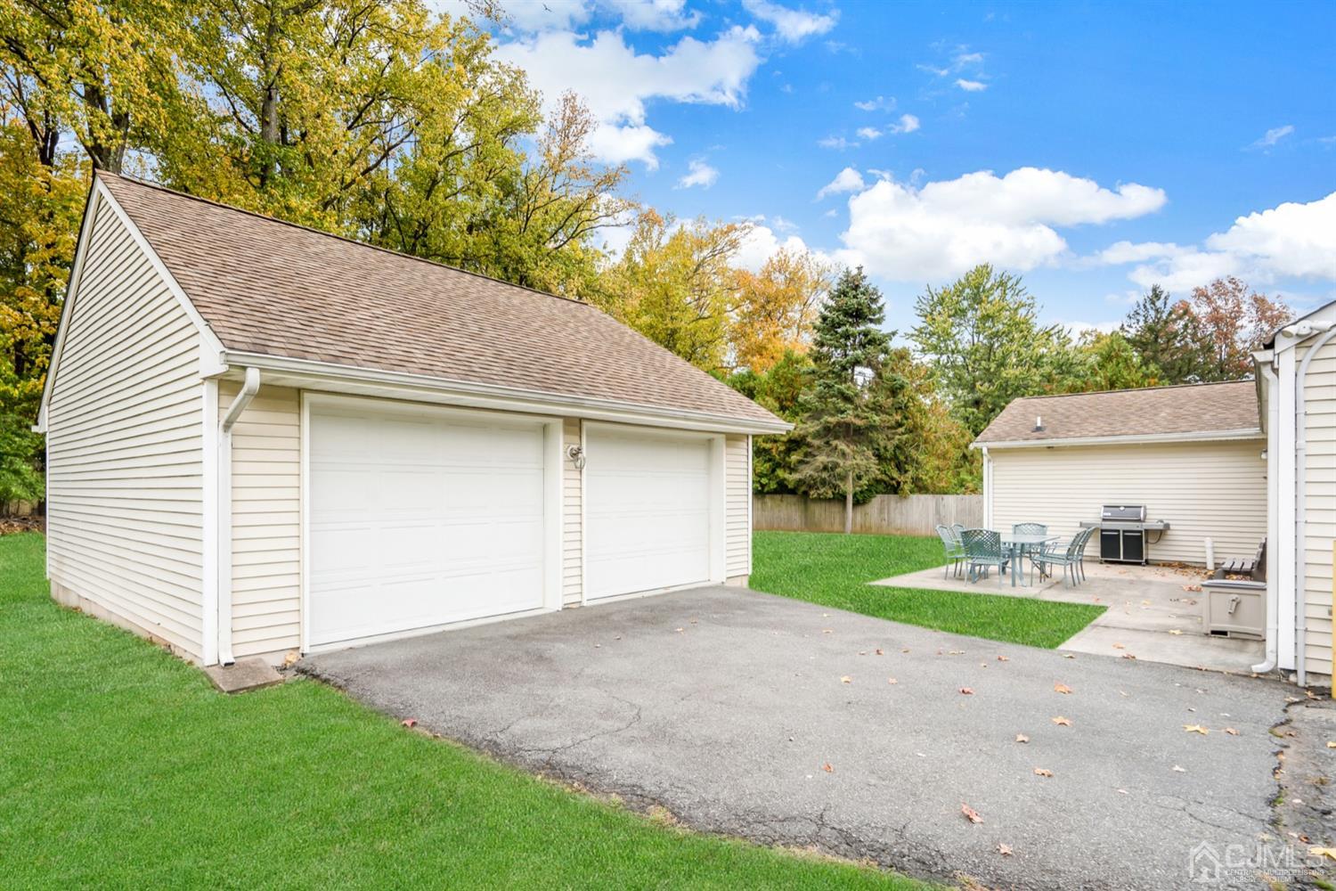38 Homestead Road Edison, NJ 08820 - Photo 14 of 15 a view of a house with a yard and garage