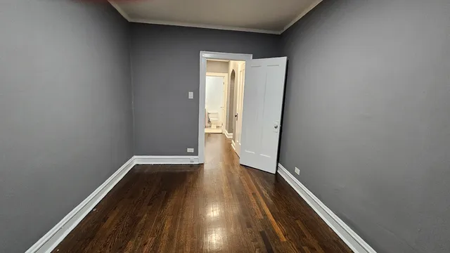 a view of wooden floor in an empty room