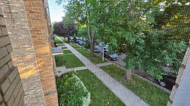 a view of a backyard with sitting area