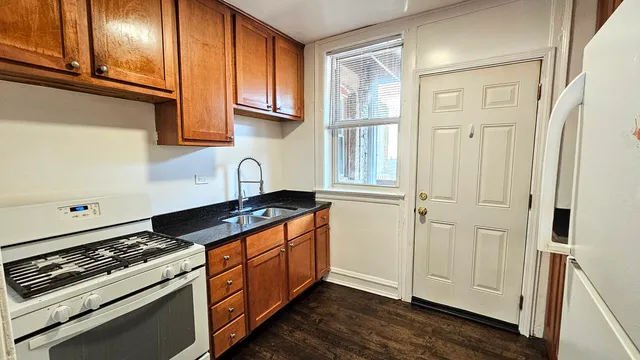 a kitchen with granite countertop cabinets and steel stainless steel appliances