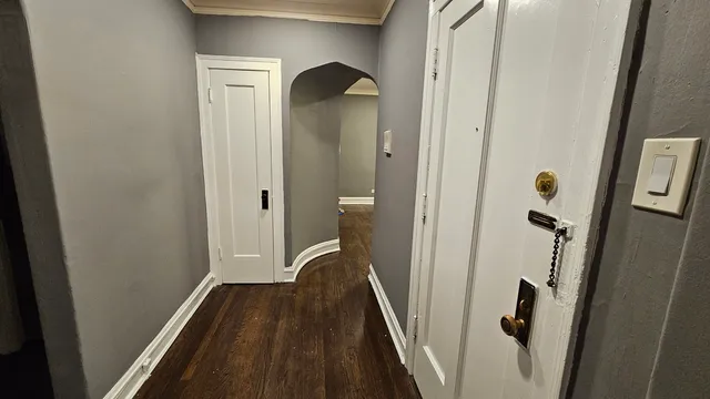 a view of a bathroom from a hallway