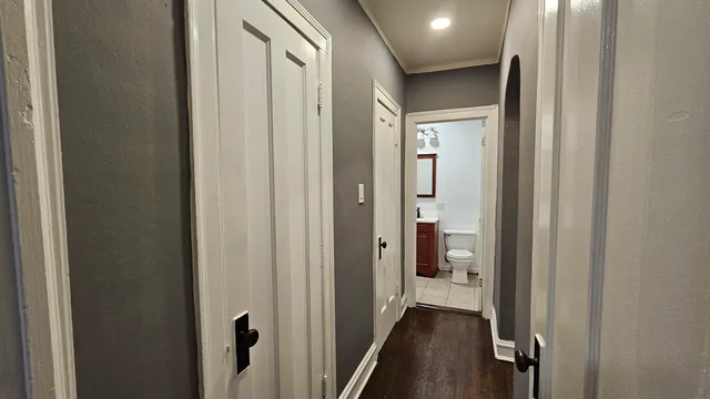 a view of a bathroom from a hallway