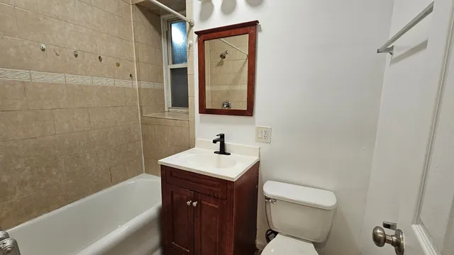 a bathroom with a sink toilet and vanity