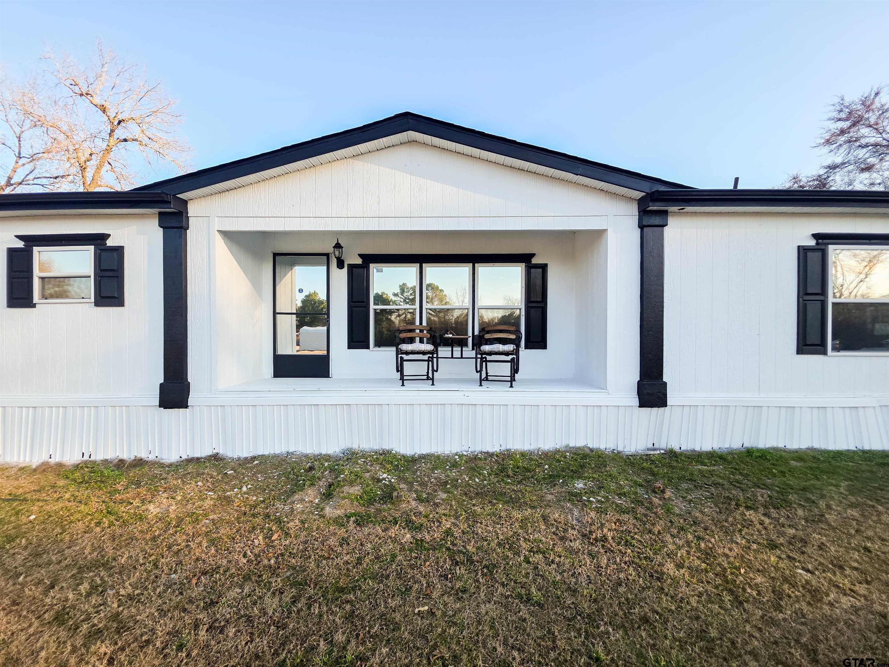 12507 Dingler Road Tyler, TX 75709 - Photo 2 of 26 a front view of a house with garden
