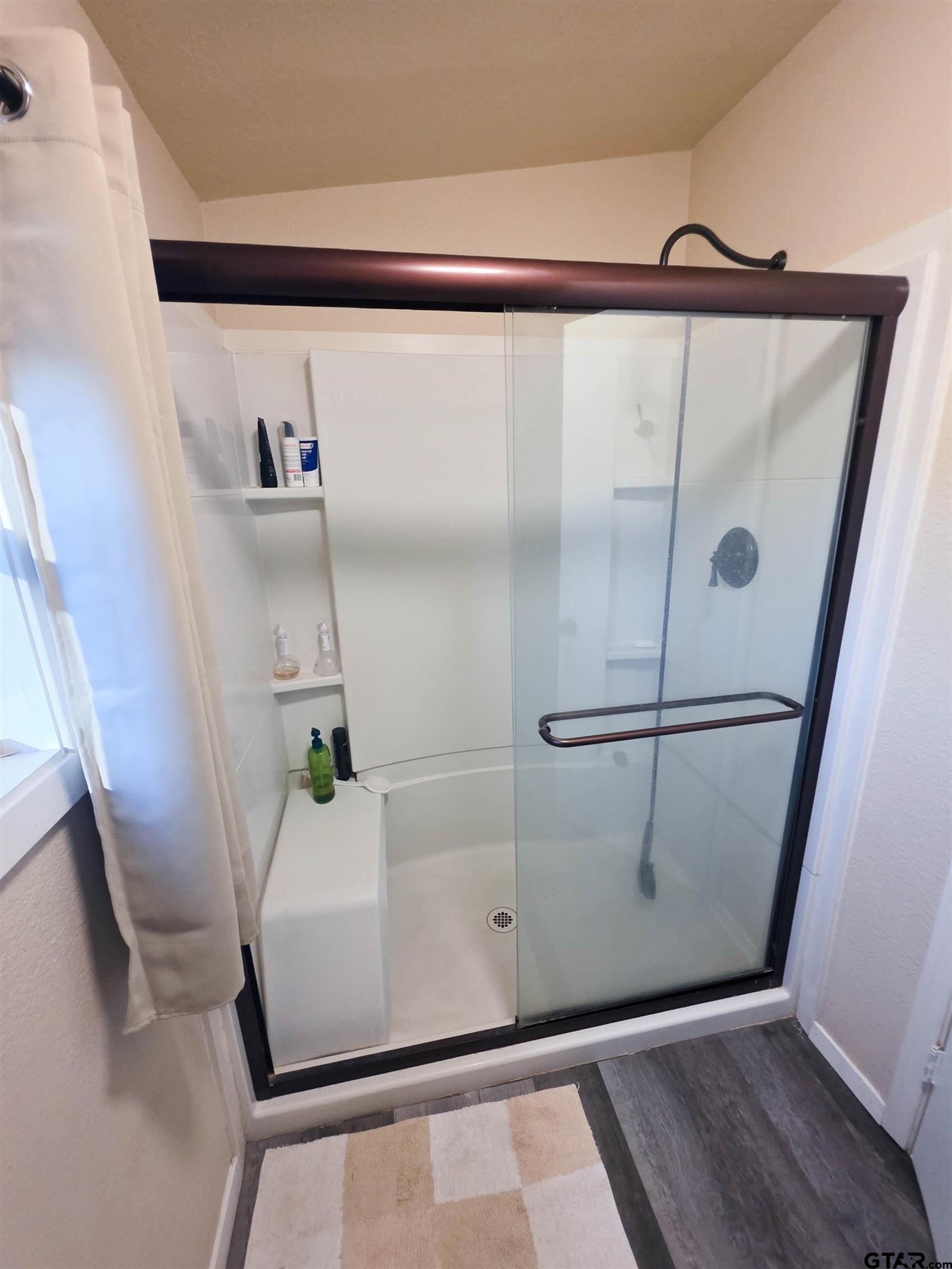 12507 Dingler Road Tyler, TX 75709 - Photo 22 of 26 a bathroom with a shower