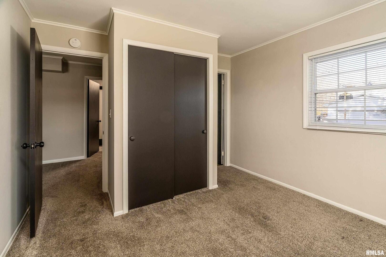 203 Fairway Vista Road Murphysboro, IL 62966 - Photo 17 of 44 an empty room with windows and closet