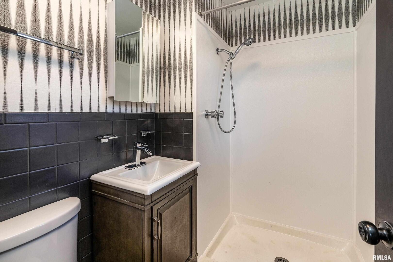 203 Fairway Vista Road Murphysboro, IL 62966 - Photo 18 of 44 a bathroom with a sink and a mirror