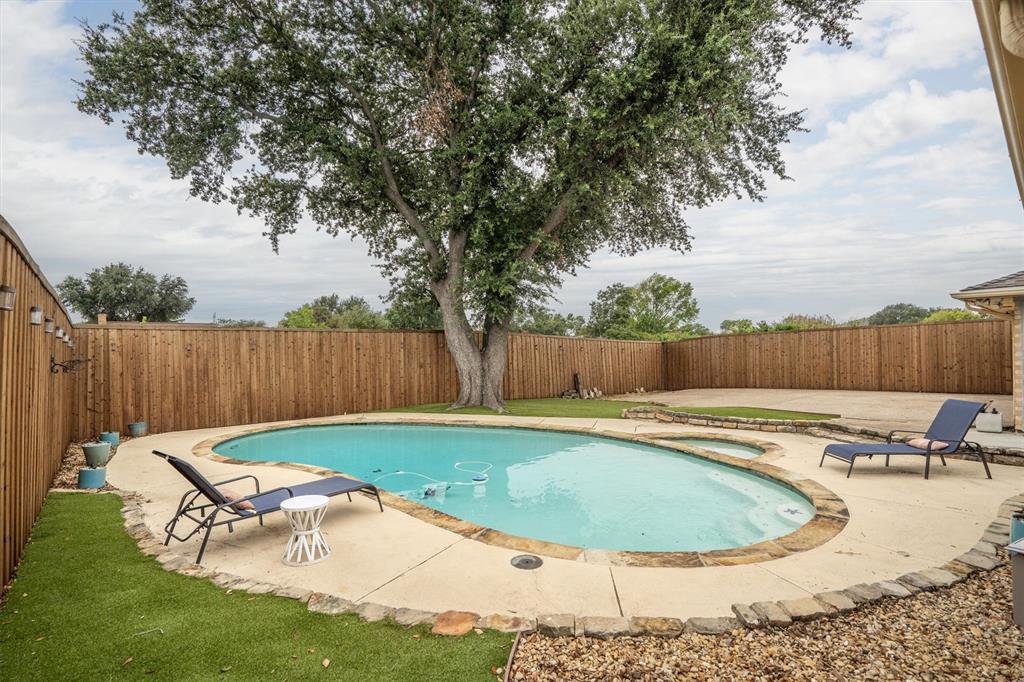2214 Valley Mill Carrollton, TX 75006 - Photo 36 of 36 a view of a swimming pool with a yard