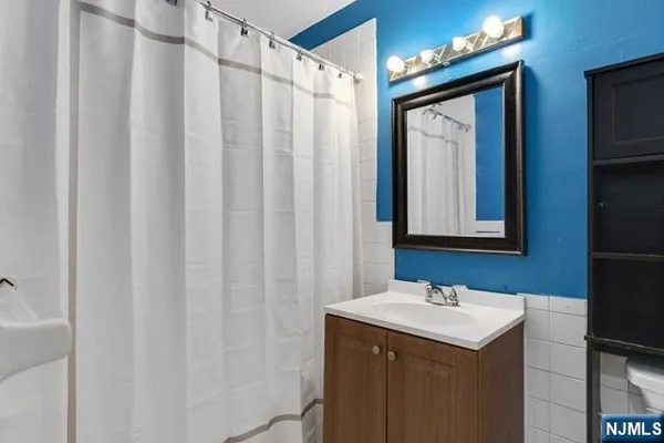 a bathroom with a sink and mirror