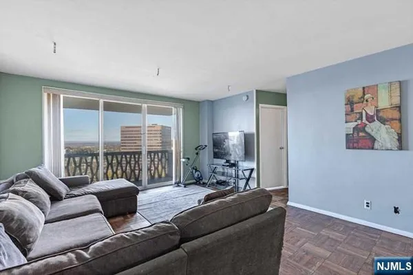 a living room with furniture and a window