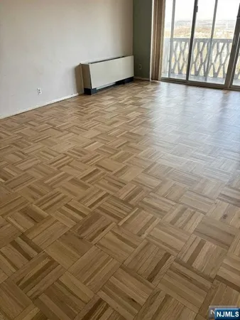 a view of a room with an empty space and a sink