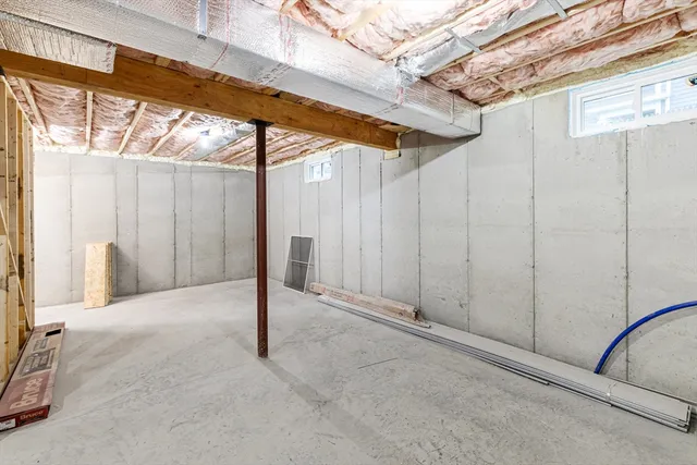 a view of a porch with a table and chairs