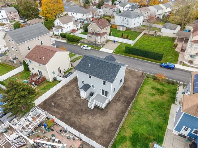 an aerial view of a house with a garden