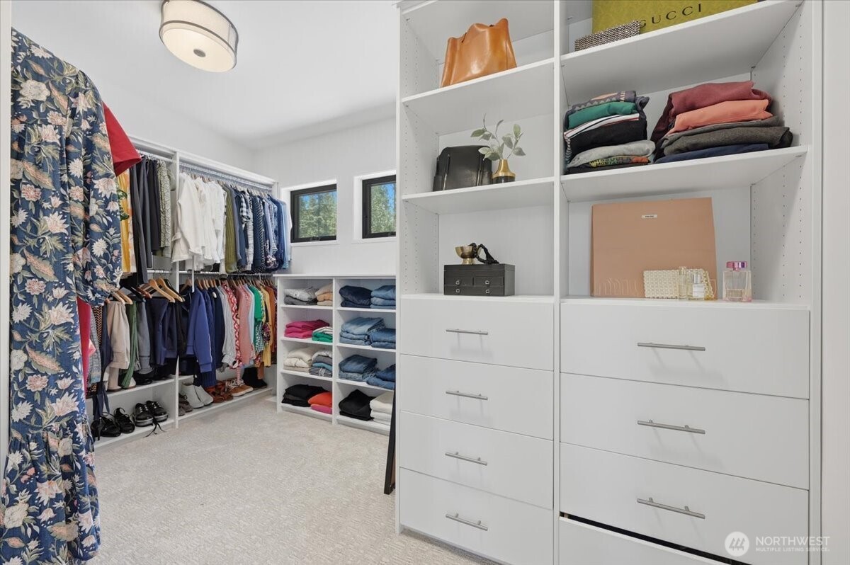 7416 Lake Alice Road Southeast Fall City, WA 98024 - Photo 20 of 40 a view of walk in closet with clothes and shoes