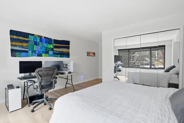 a bedroom with furniture and a window