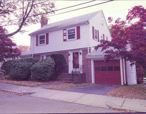 8 Latin Road Boston, MA 02132 - Photo 1 of 1 a front view of a house with a yard and garage