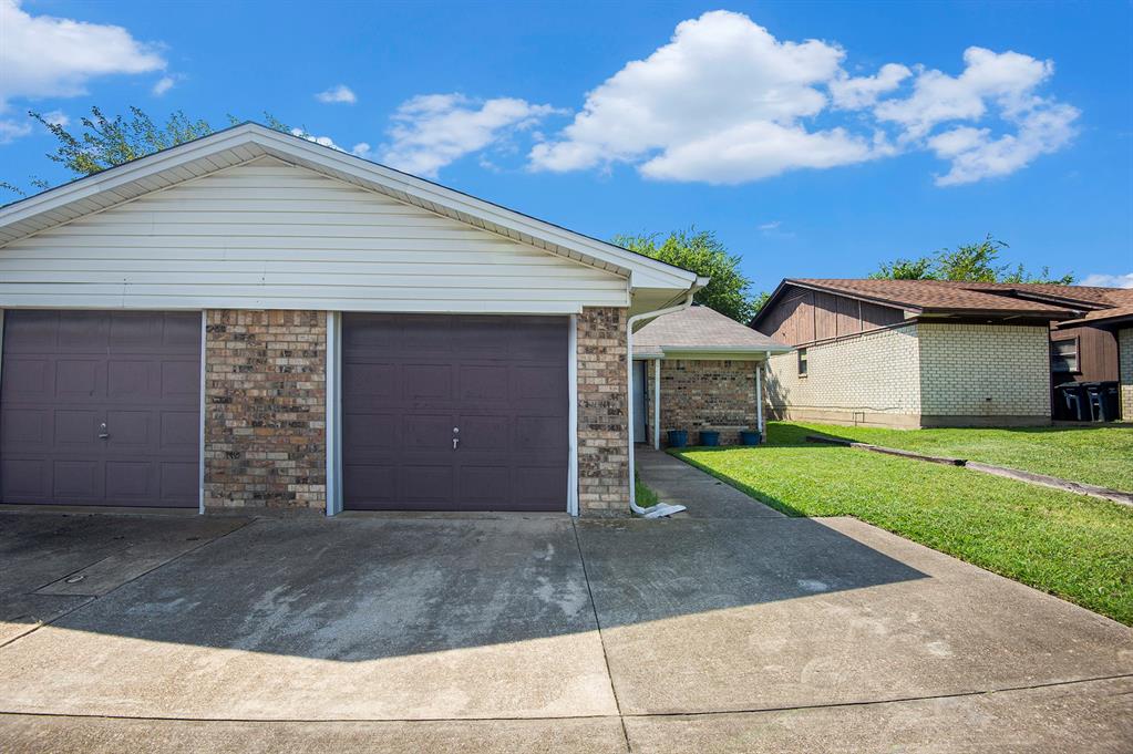 6819 West Cleburne Road Fort Worth, TX 76133 - Photo 1 of 24 a view of a house with a yard and garage