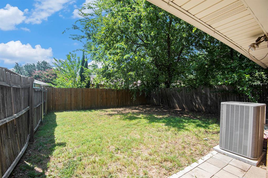 6819 West Cleburne Road Fort Worth, TX 76133 - Photo 22 of 24 a view of small garden with wooden fence