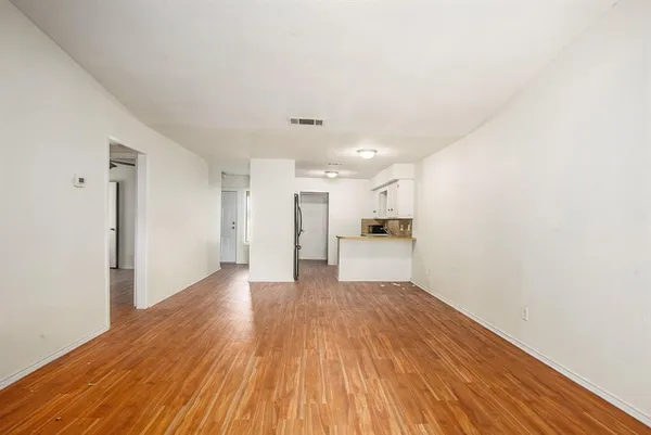 a view of kitchen with wooden floor