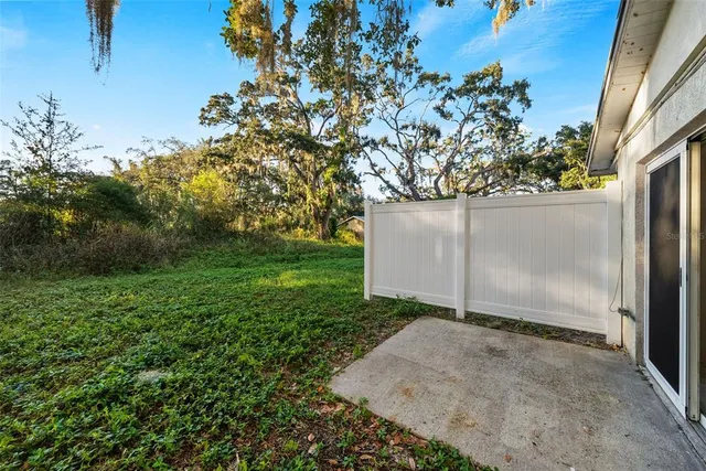 a backyard of a house with lots of green space