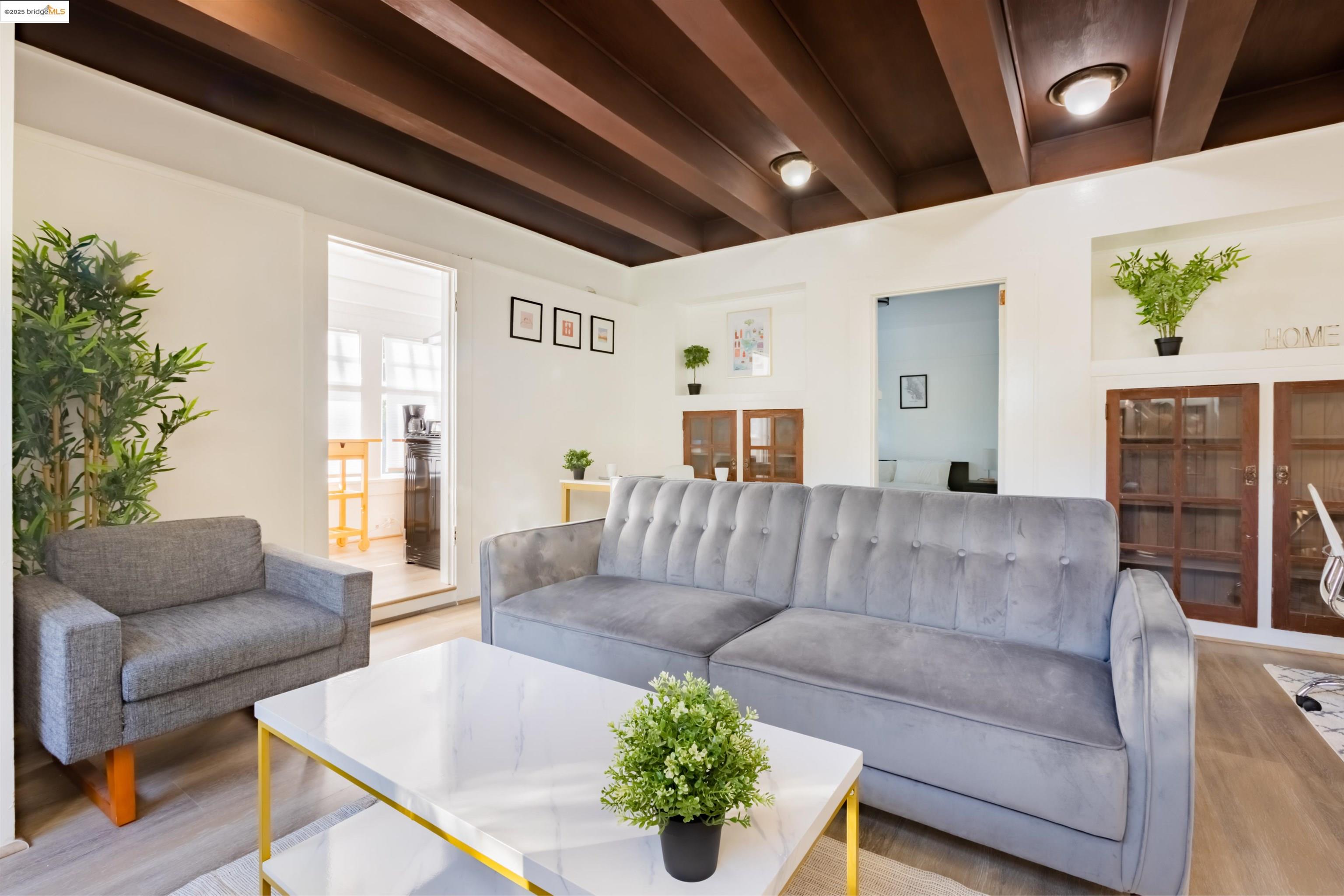 400 Lagunitas Avenue Oakland, CA 94610 - Photo 3 of 14 a living room with furniture and a couch
